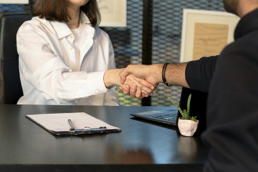 Certified candidate shaking hands after a job interview